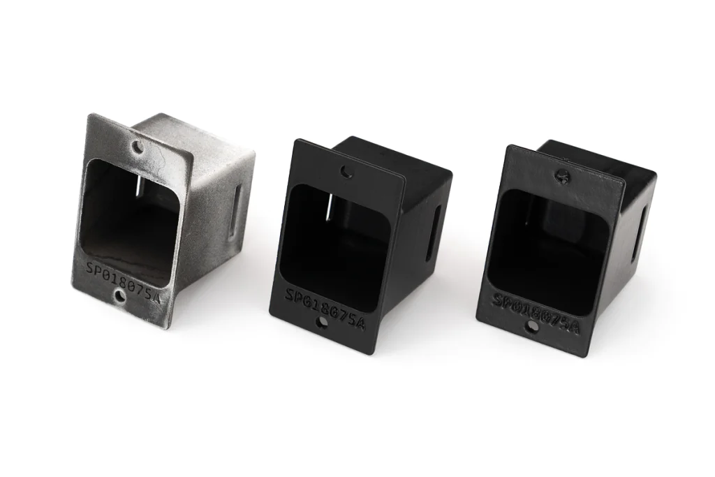 Three SLS 3D-printed parts shown side-by-side: one raw and powdery, one with a matte smoothed finish, and one over-smoothed with visible surface distortion, on a white background.