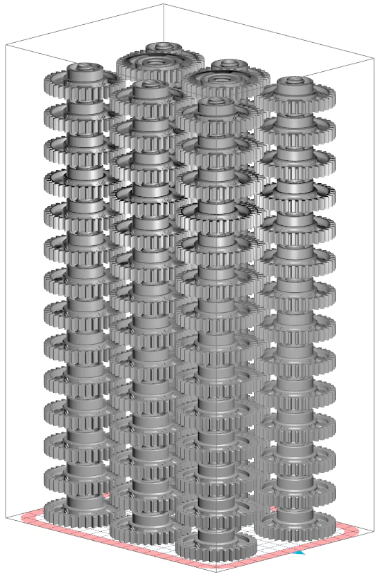 3D SLS build chamber filled with stacked cylindrical gear-like parts